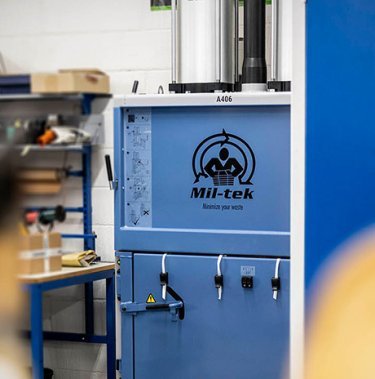 The operation of a cardboard baler